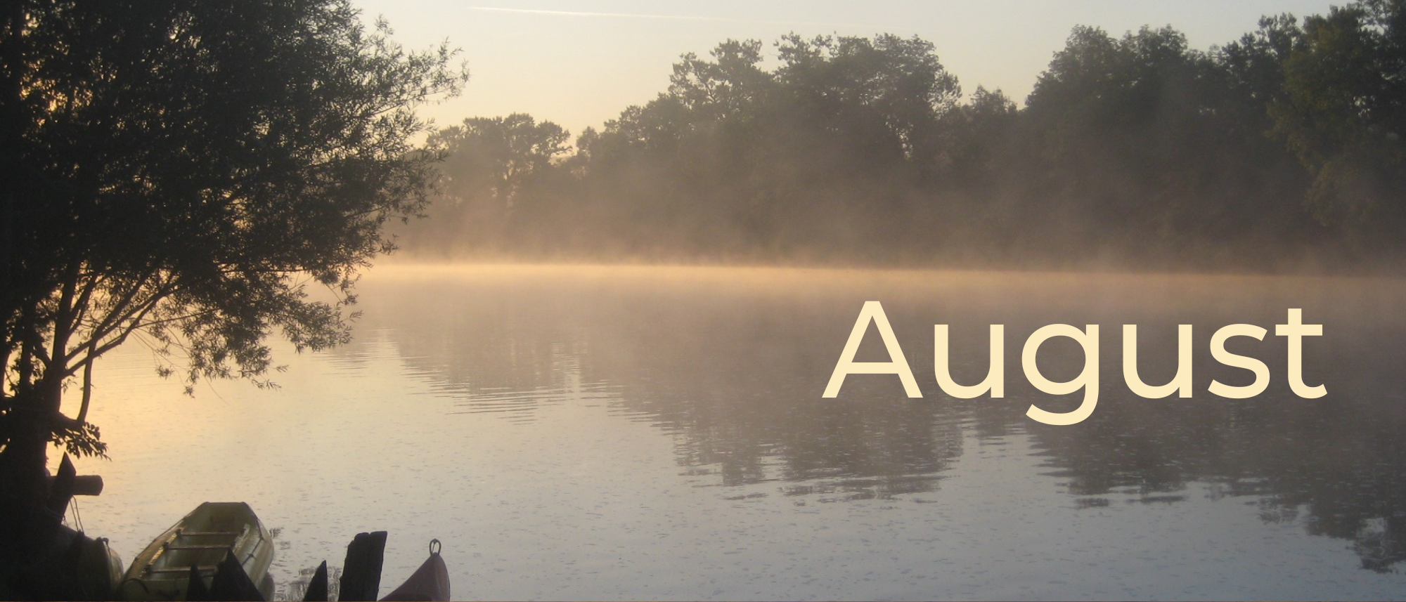 Foggy lake at dusk. Written text: August