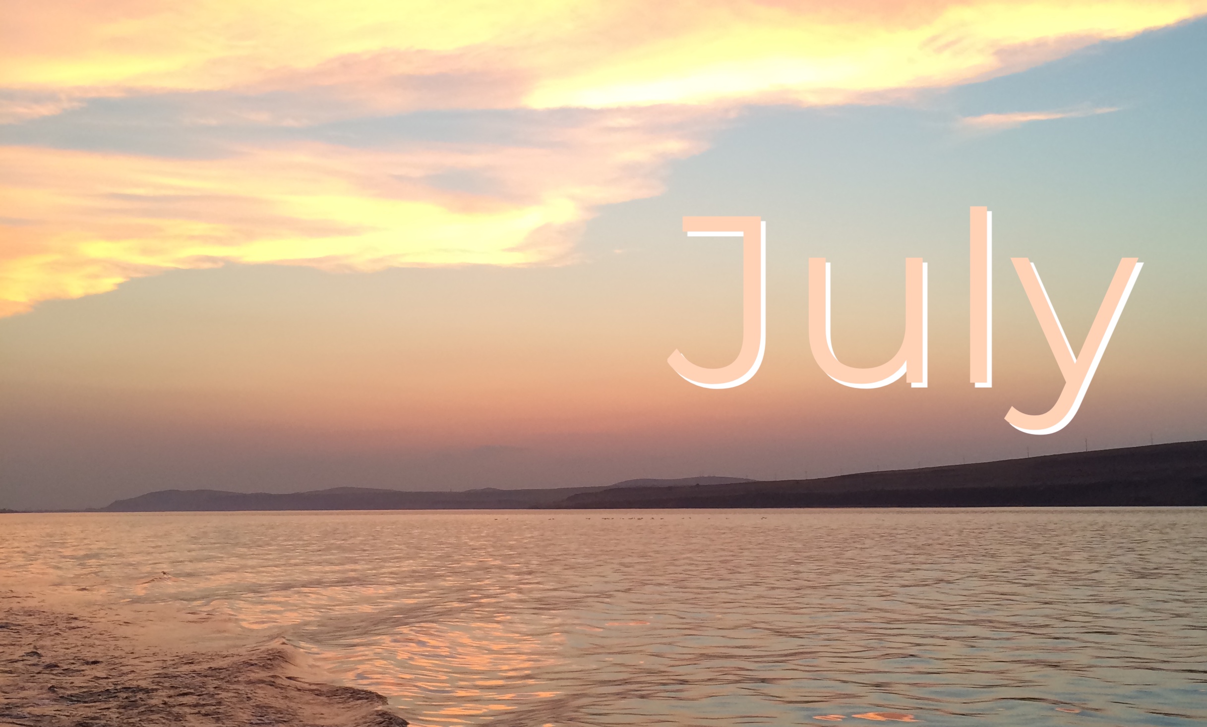 Sunset with July text