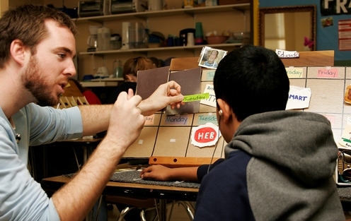 Matt teaching young boy calendars.