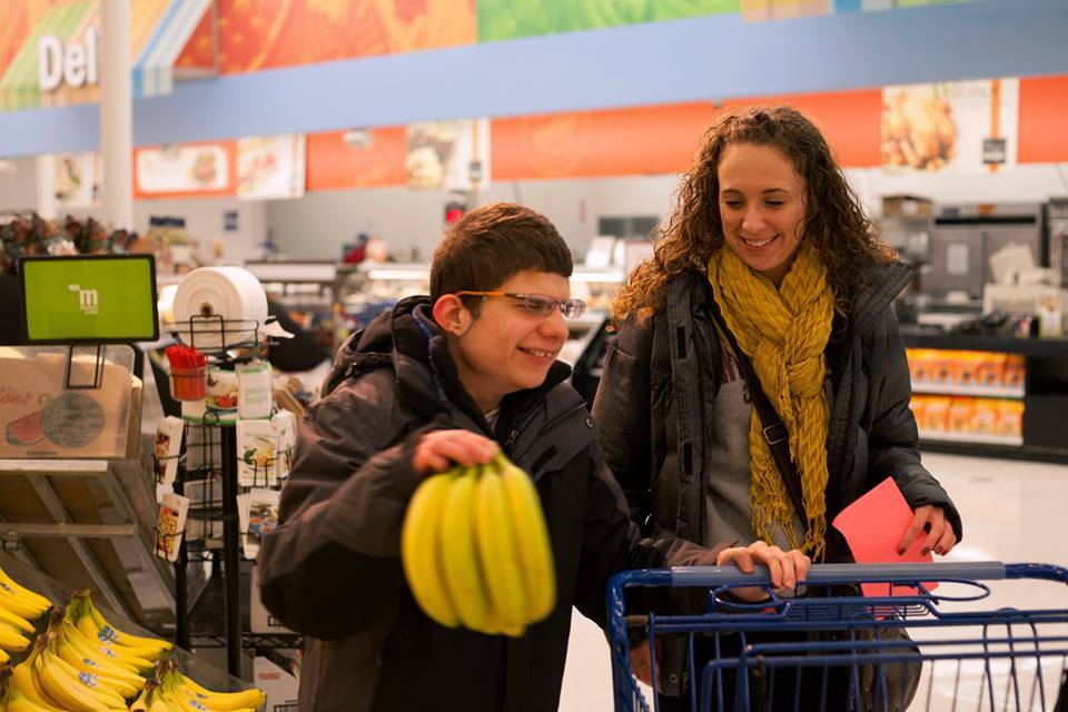 Young man shopping at grocery store.