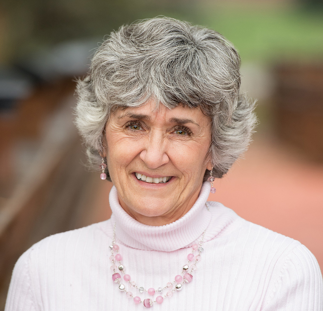 Smiling woman with grey hair