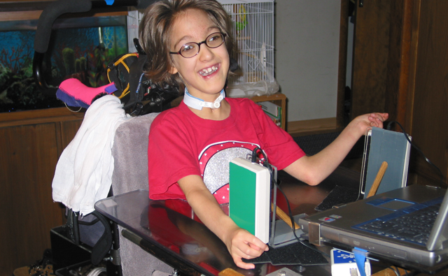 Girl in wheel chair with literacy technology